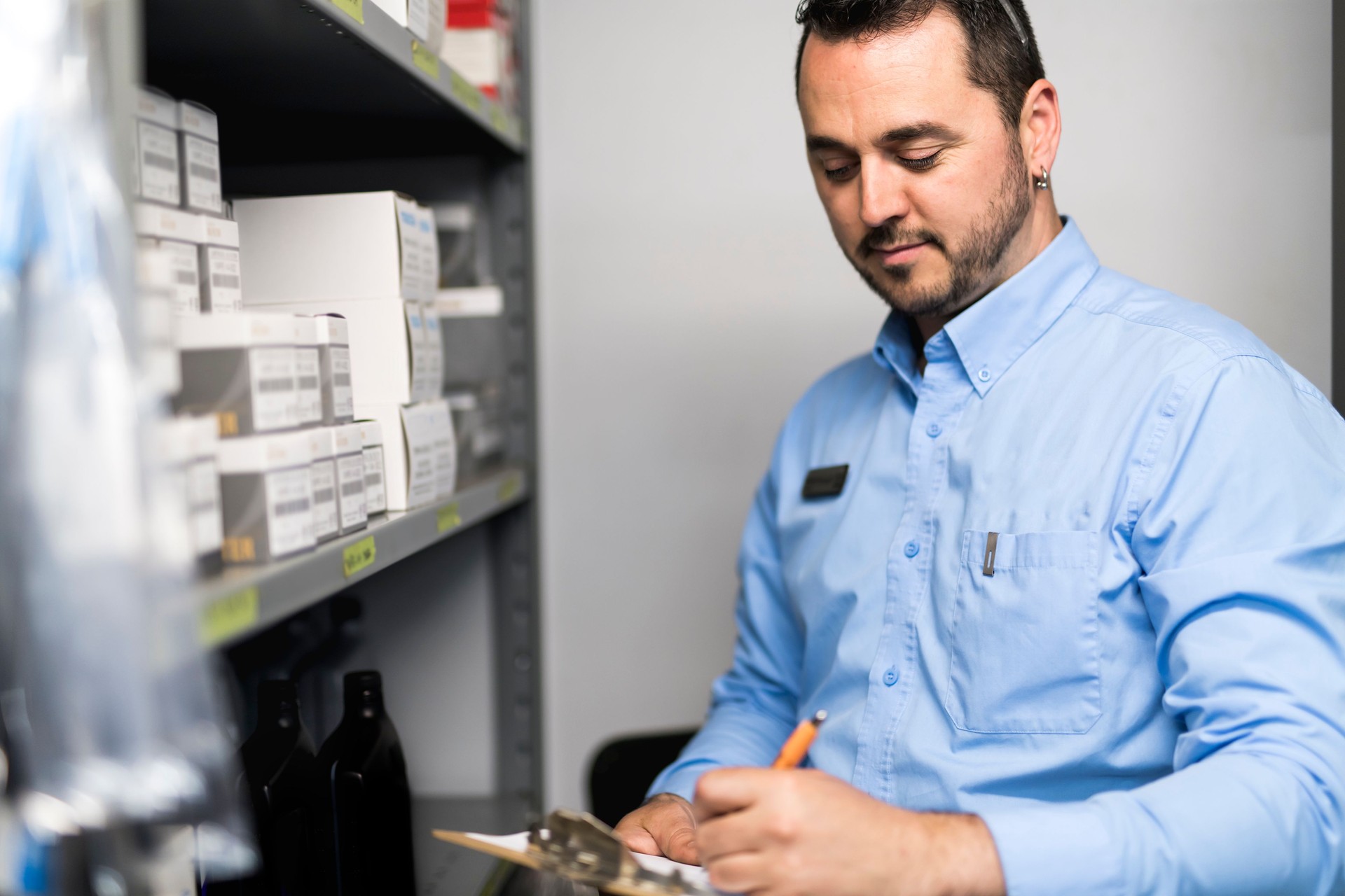 merchandiser checking products availibility for car repair